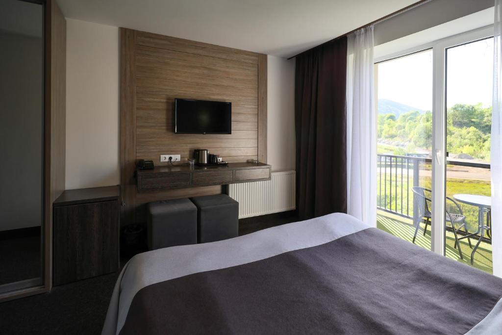 Postel nebo postele na pokoji v ubytování VILSON hotel