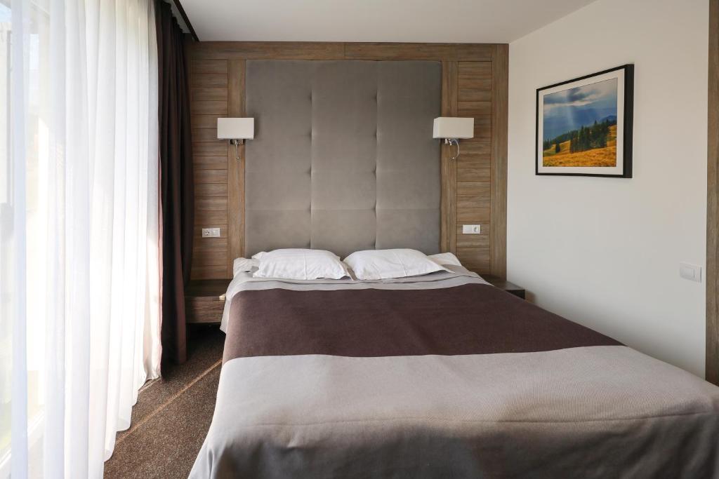 Postel nebo postele na pokoji v ubytování VILSON hotel