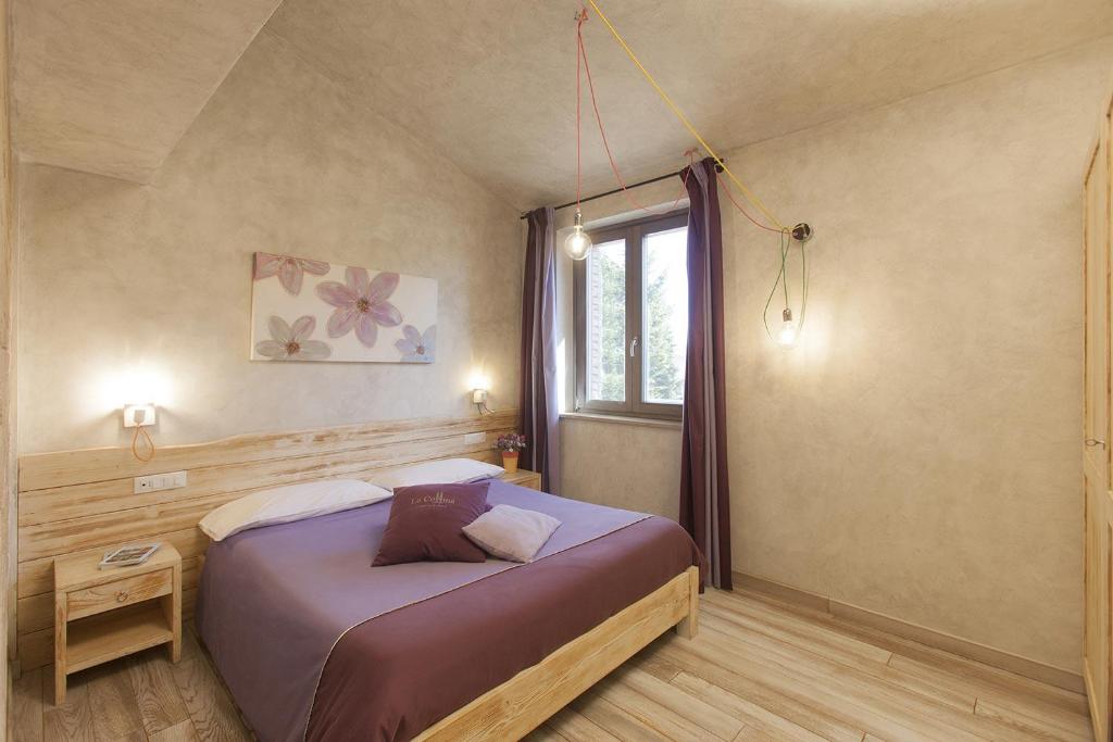 Een bed of bedden in een kamer bij Agriturismo La Collina
