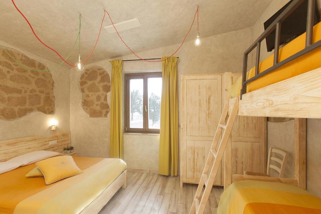 Een bed of bedden in een kamer bij Agriturismo La Collina