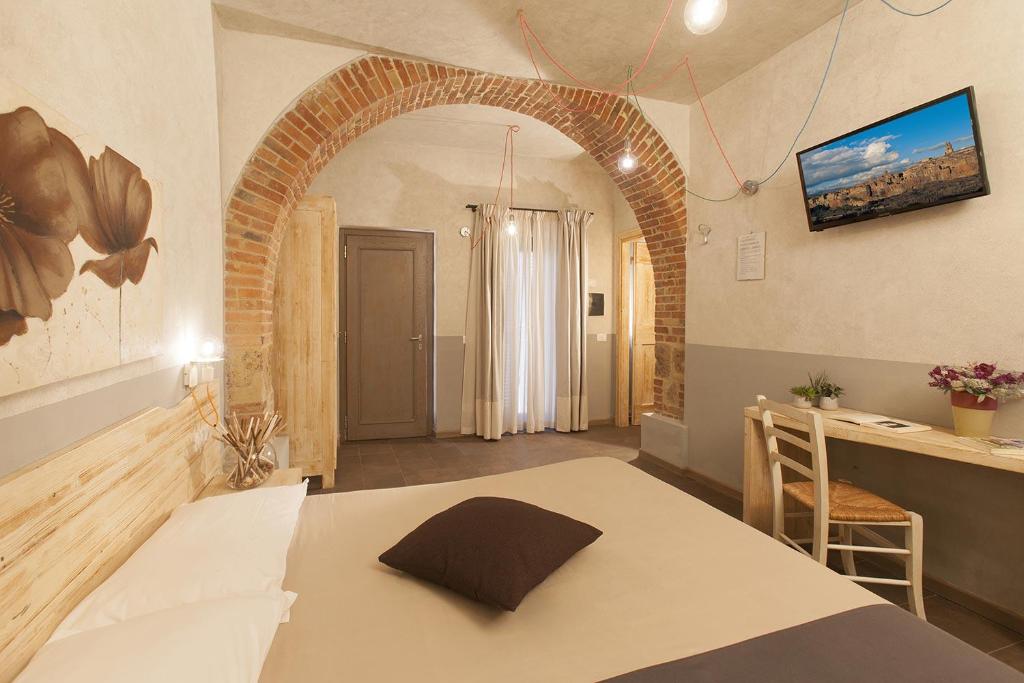 Een bed of bedden in een kamer bij Agriturismo La Collina