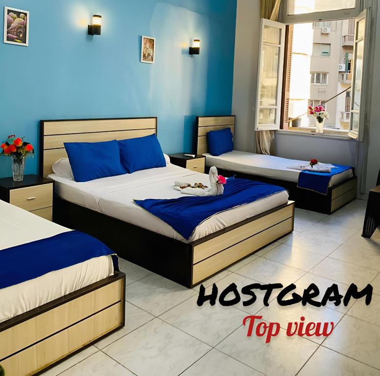 Postel nebo postele na pokoji v ubytování Hostgram Top View