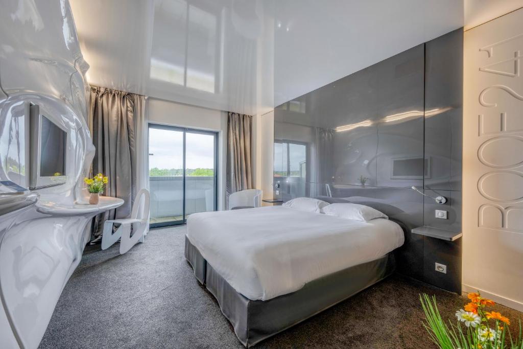 Postel nebo postele na pokoji v ubytování Comfort Aparthotel Bassin d'Arcachon