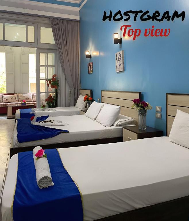 Postel nebo postele na pokoji v ubytování Hostgram Top View