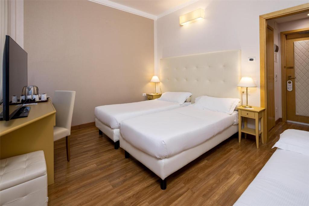 Łóżko lub łóżka w pokoju w obiekcie Best Western Air Hotel Linate