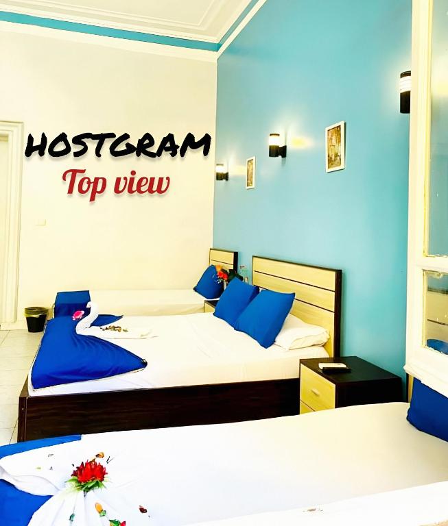 Postel nebo postele na pokoji v ubytování Hostgram Top View