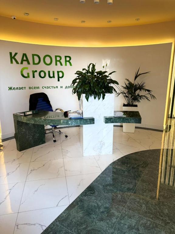 a sign for a laptop group in a lobby at VIP Apartments 57 in Odesa