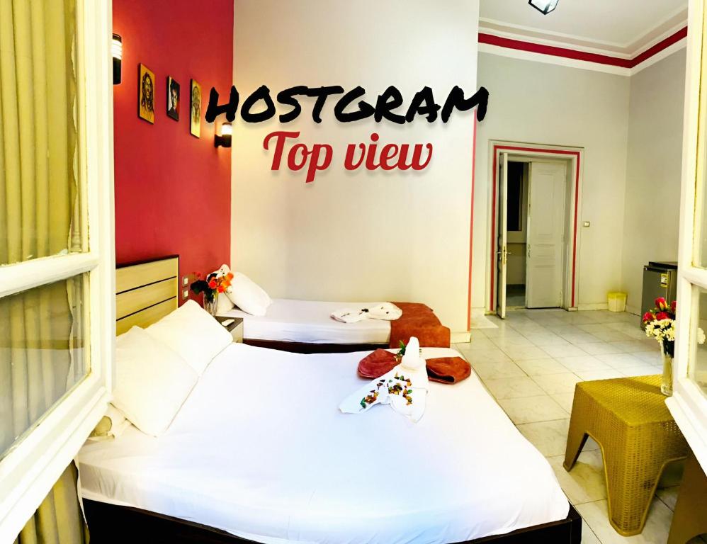 Postel nebo postele na pokoji v ubytování Hostgram Top View