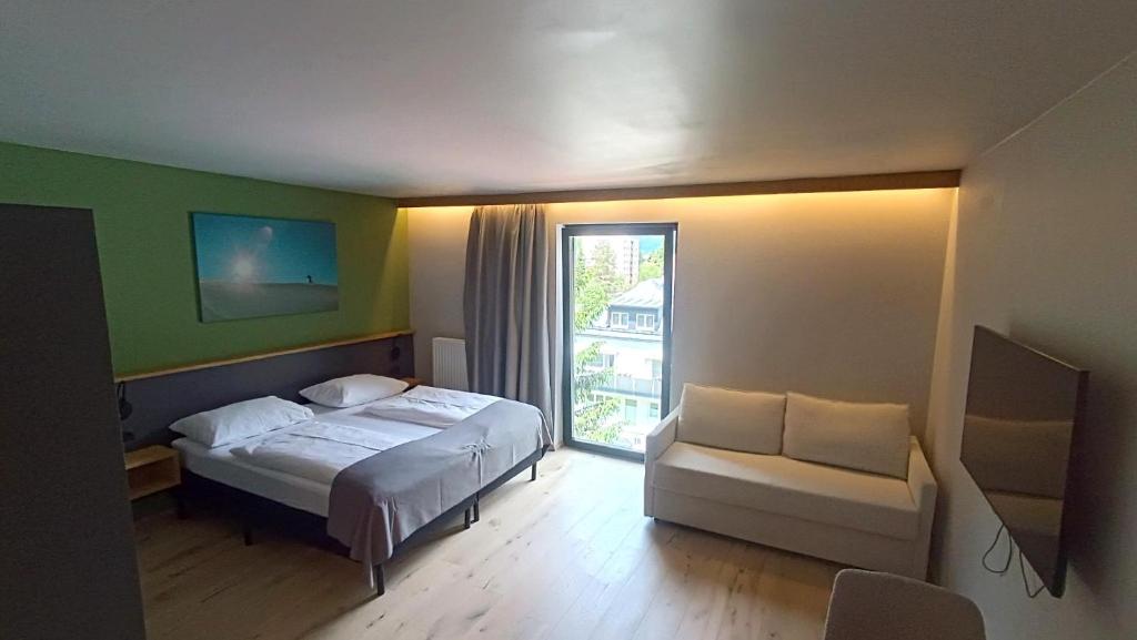 Ein Bett oder Betten in einem Zimmer der Unterkunft Hotel Simader