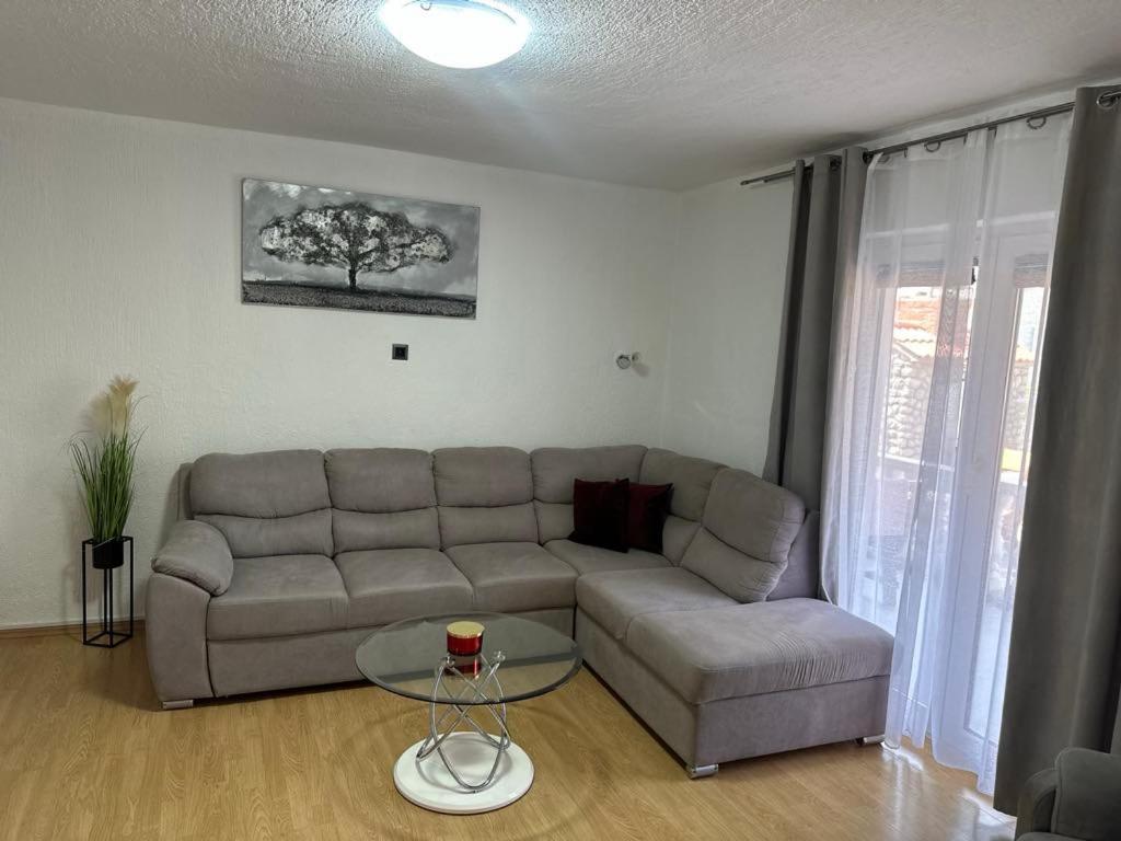 a living room with a couch and a table at Apartment King in Senj