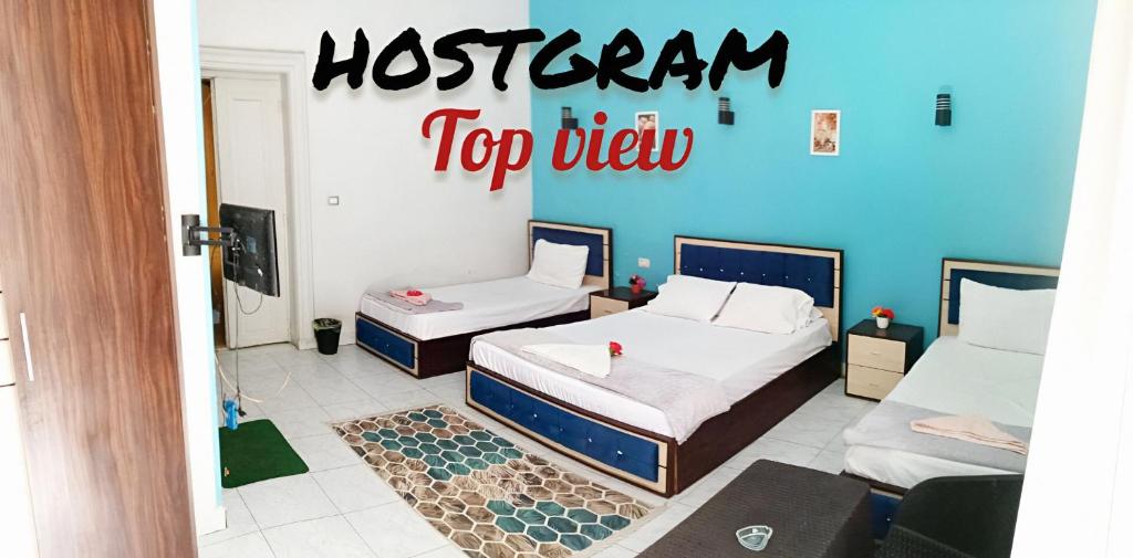Postel nebo postele na pokoji v ubytování Hostgram Top View