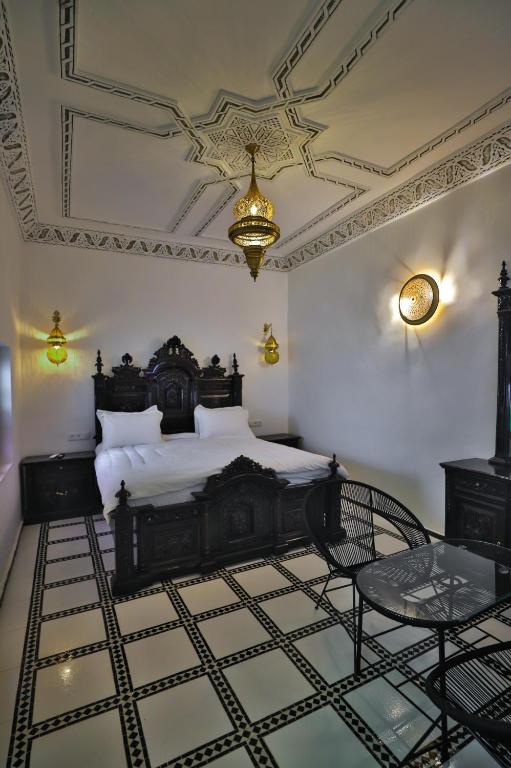Postel nebo postele na pokoji v ubytování Riad Old City Palace
