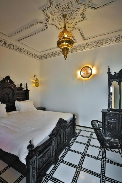 Postel nebo postele na pokoji v ubytování Riad Old City Palace