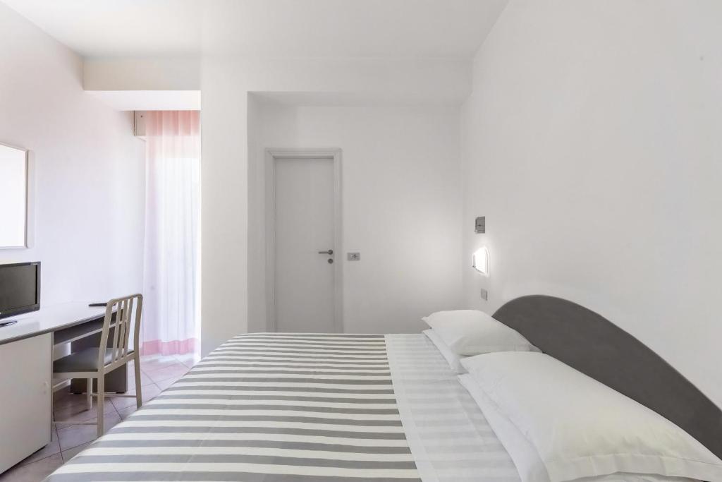 Postel nebo postele na pokoji v ubytování Hotel Sole