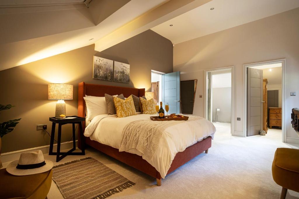 a bedroom with a large bed in a room at Curlew Loft in Lancaster