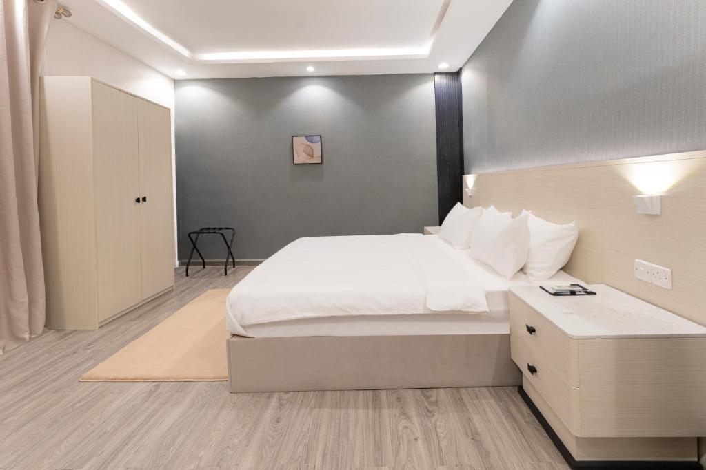 Postel nebo postele na pokoji v ubytování الكراني للشقق الفندقية - AlKrrani Serviced Apartments