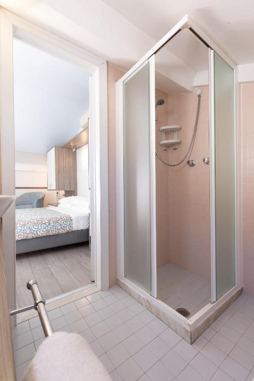 Postel nebo postele na pokoji v ubytování Hotel Sole