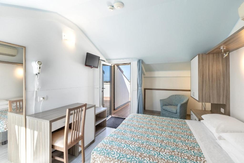 Postel nebo postele na pokoji v ubytování Hotel Sole