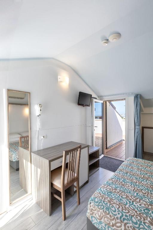 Postel nebo postele na pokoji v ubytování Hotel Sole
