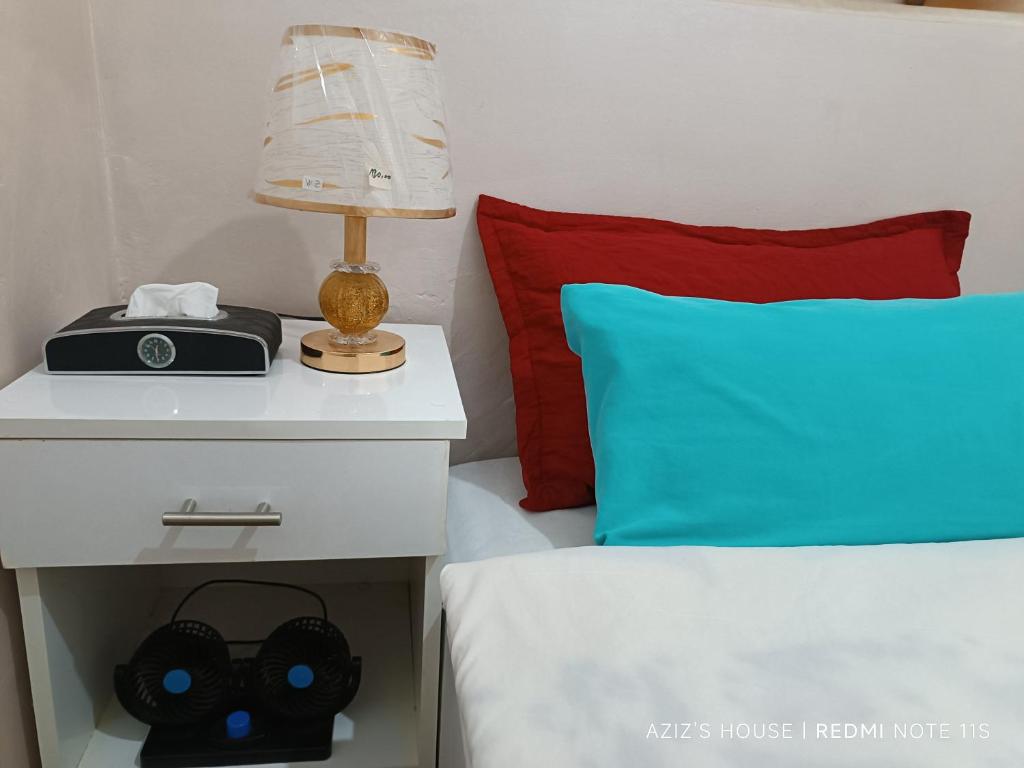 Una cama o camas en una habitación de Aziz House 2
