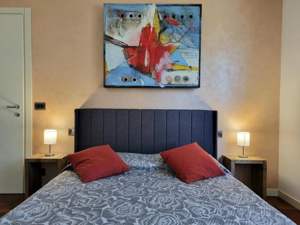 En eller flere senge i et værelse på Parma Comfort House