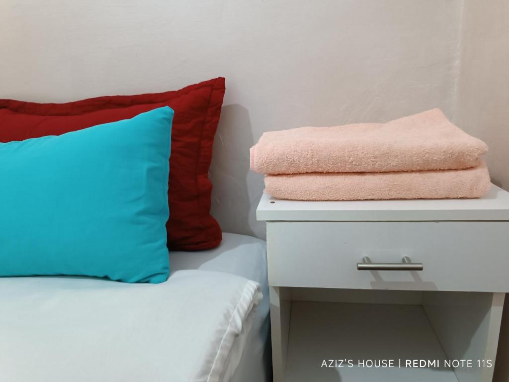 Una cama o camas en una habitación de Aziz House 2