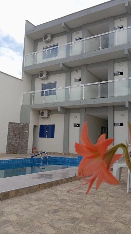 a kite is flying in front of a building at A M Hotel in São Luís