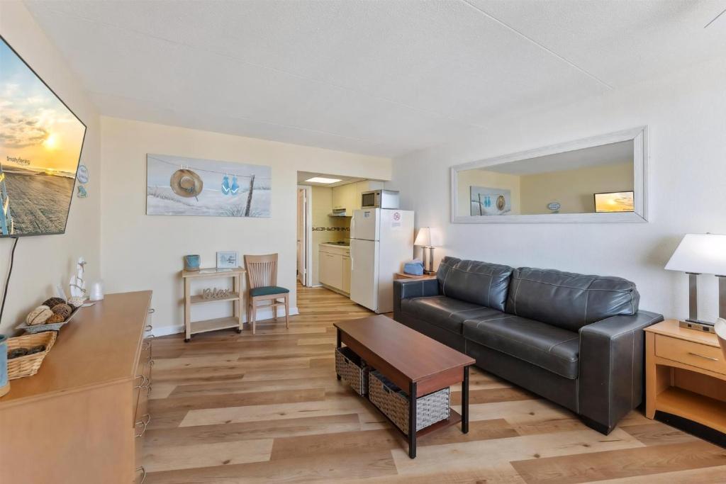a living room with a couch and a table at 6201 Ocean Ave, Unit 505 - The Nassau Inn in Wildwood