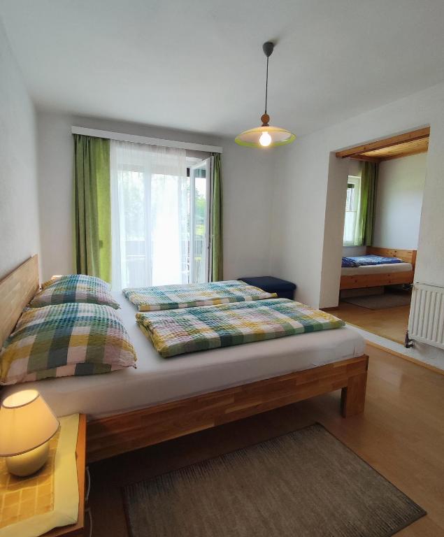 Postel nebo postele na pokoji v ubytování Haus Primosch
