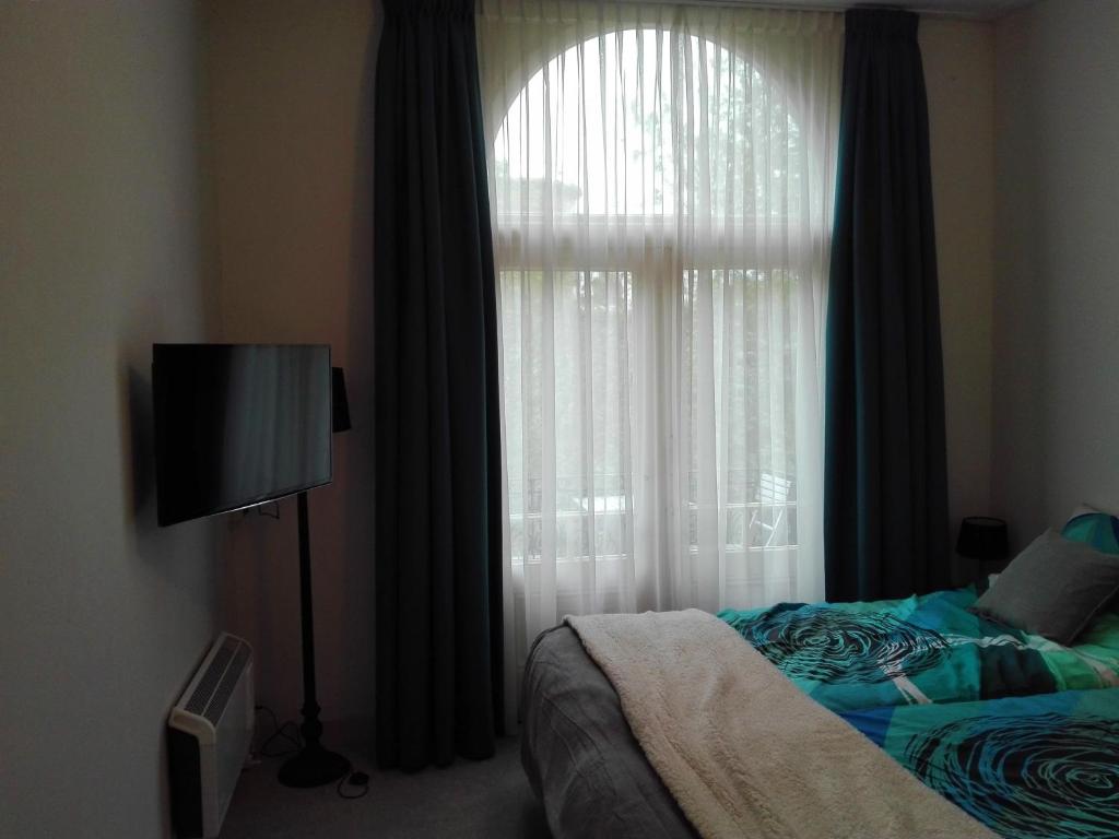 Ένα ή περισσότερα κρεβάτια σε δωμάτιο στο City Lodge Stay A while