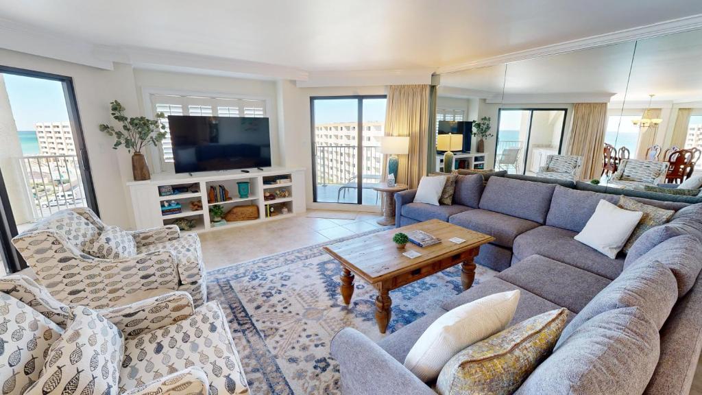 a living room with a couch and a table at Inlet Reef 609 in Destin
