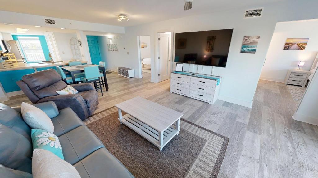 a living room with a couch and a table at SeaCrest 306 in Fort Walton Beach