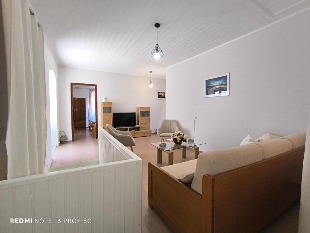 TV a/nebo společenská místnost v ubytování Poseidon Apartments