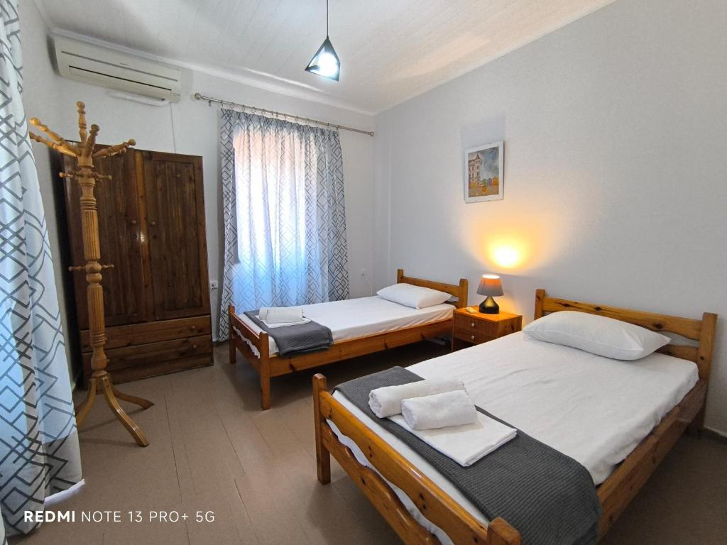 Postel nebo postele na pokoji v ubytování Poseidon Apartments