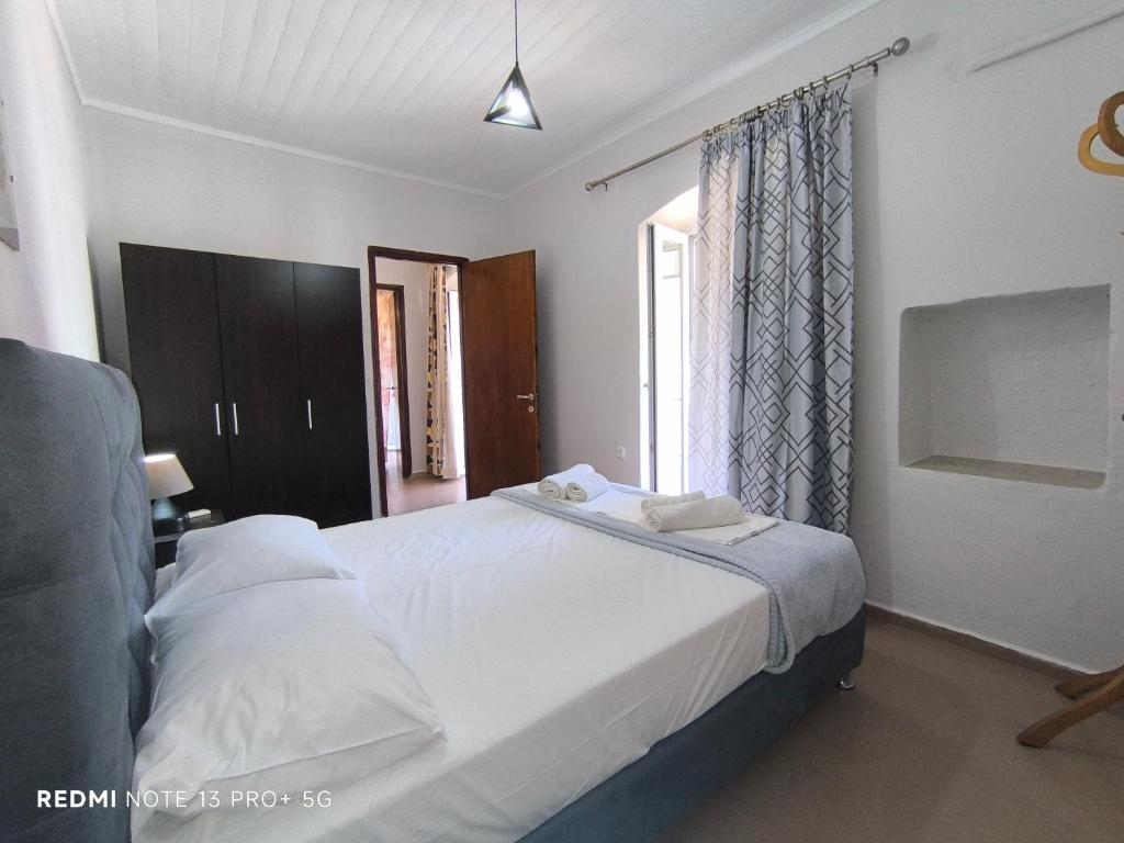Postel nebo postele na pokoji v ubytování Poseidon Apartments