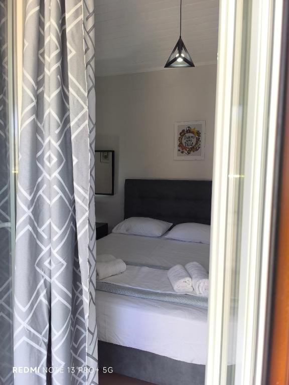Postel nebo postele na pokoji v ubytování Poseidon Apartments