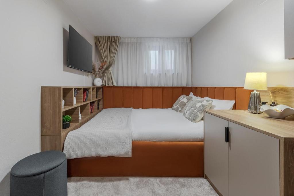 Postel nebo postele na pokoji v ubytování Oasis Rooms