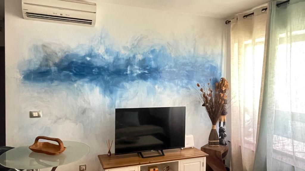 Televízia a/alebo spoločenská miestnosť v ubytovaní Corralejo Casa Jasmine