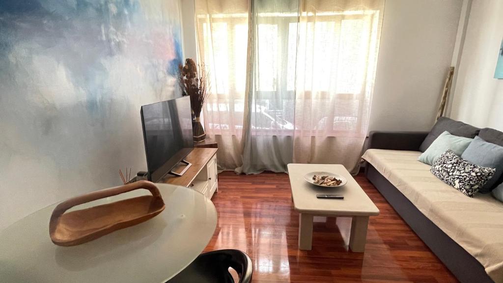 Televízia a/alebo spoločenská miestnosť v ubytovaní Corralejo Casa Jasmine