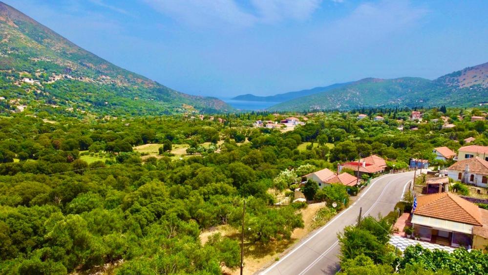 an aerial view of a village with a road and mountains at Villa Joya in Makriótika