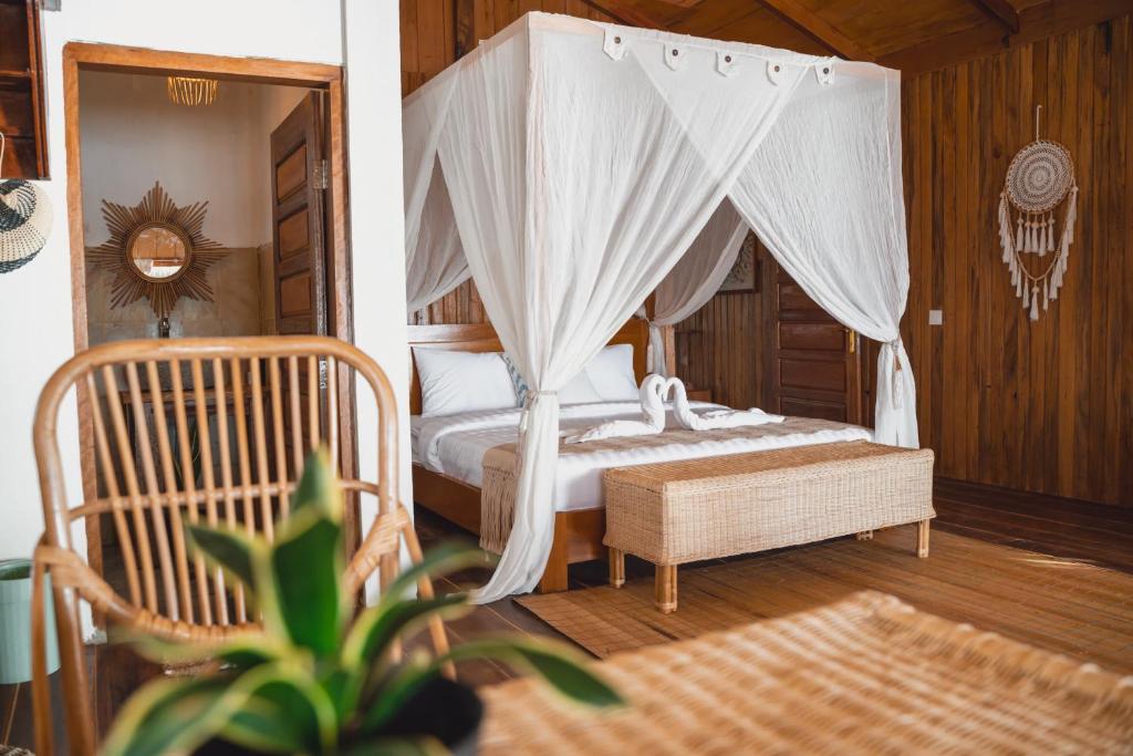 Postel nebo postele na pokoji v ubytování Oinan Beach Villa