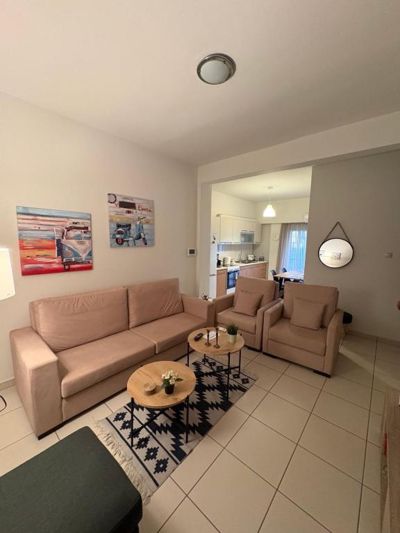 a living room with a couch and a table at Athina’s apartment in Athens