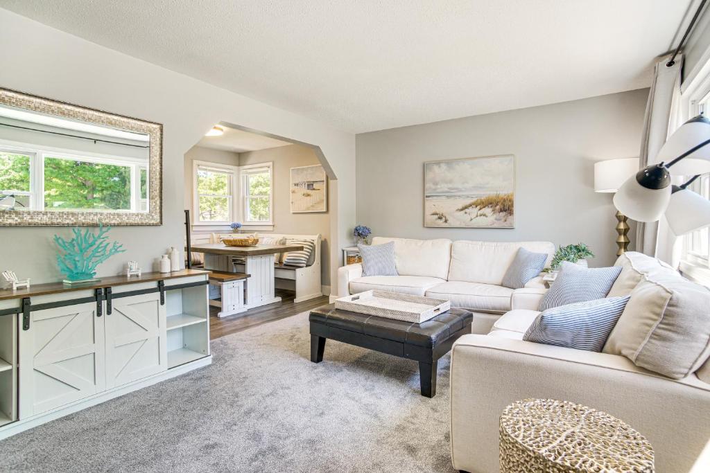 a living room with a couch and a table at Private Beach and Fire Pit Cape Cod Retreat! in Falmouth