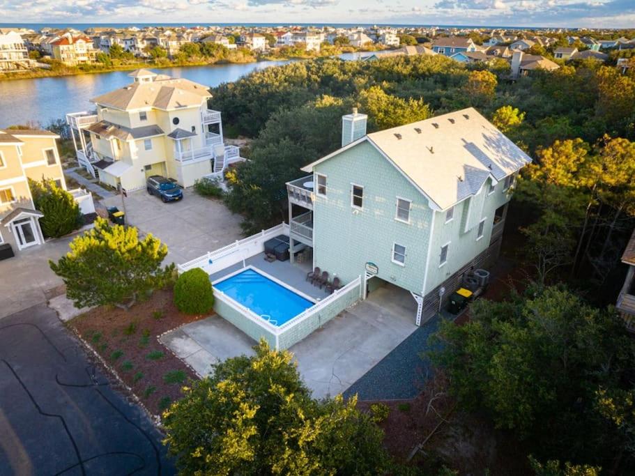 an aerial view of a house with a swimming pool at Private Pool Spa & Spacious Deck in Corolla