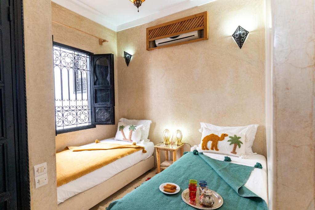 Postel nebo postele na pokoji v ubytování Riad Shambala