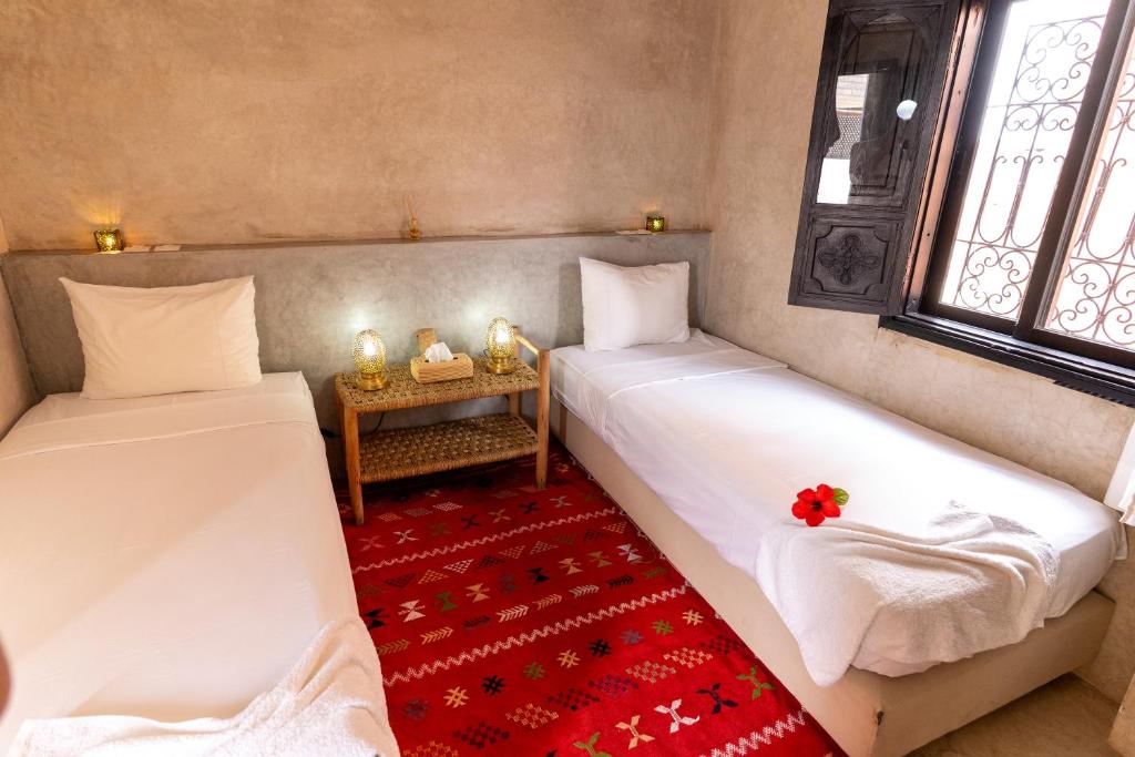 Postel nebo postele na pokoji v ubytování Riad Shambala