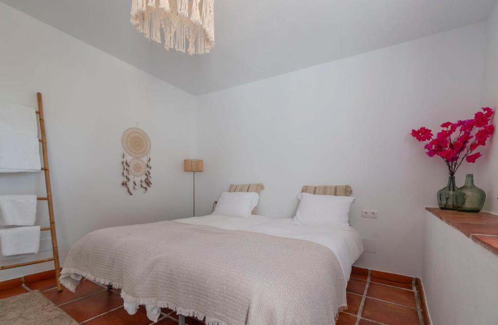 Postel nebo postele na pokoji v ubytování Casa Tragabalas