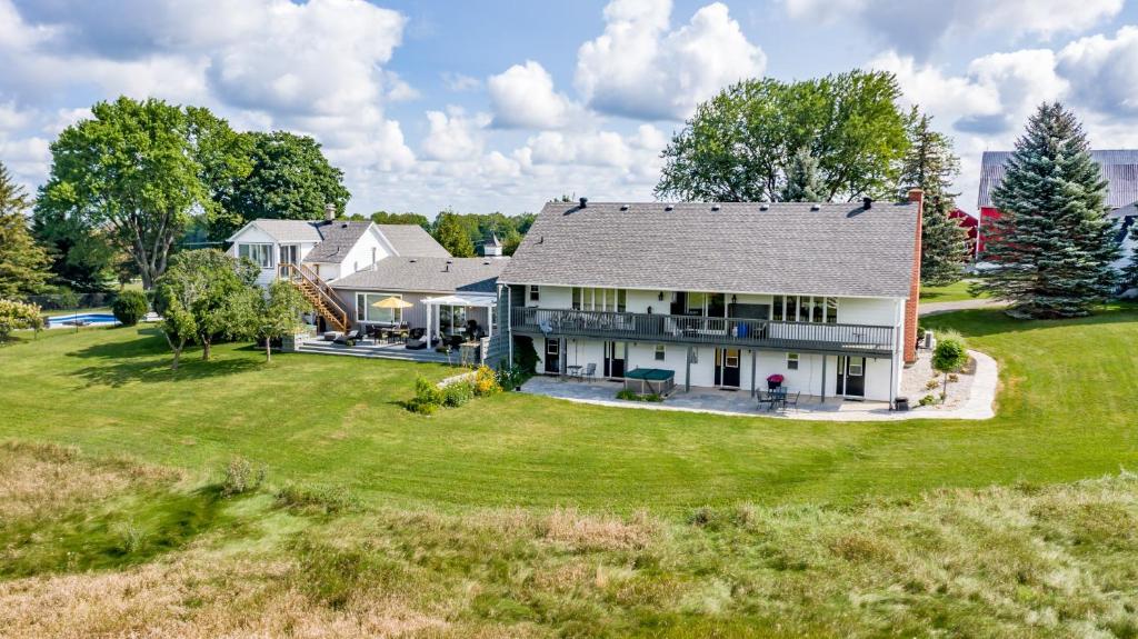 an aerial view of a house with a yard at Mountain Ash Country Manor and Spa in Creemore