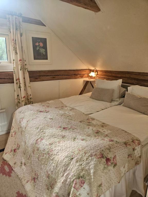 Postel nebo postele na pokoji v ubytování Ranch Mörby