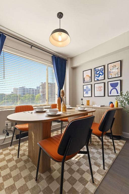 a dining room with a table and chairs at Free Parking - 1BR Arlington Stay Near DC in Arlington